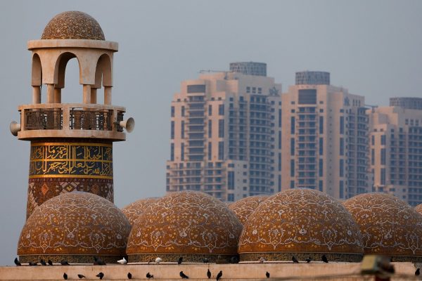 This picture shows the minaret of Katara Mosque, also known as "Qatar's Turquoise Mosque, designed by Turkish architect Zainab Fadil Oglu, in Katara Cultural Village in Doha on July 15, 2025. (Photo by Karim JAAFAR / AFP)
